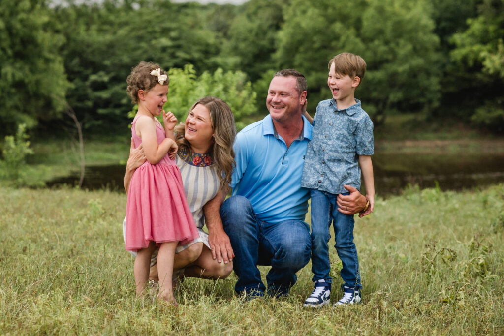 Outdoor North Texas family photos in a pasture; two kids