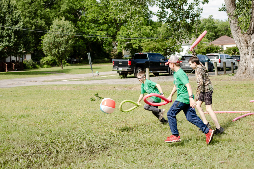 Pool noodle hockey at homeschool field day