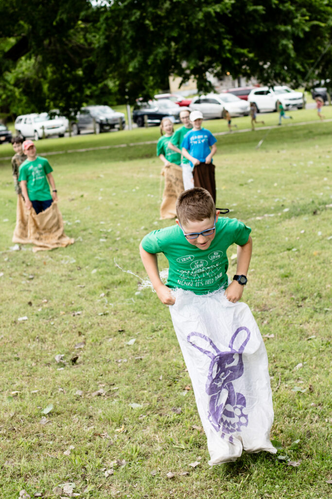 Potato sack race at homeschool field day